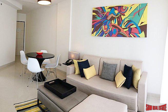 Cassia Residence | Sea and Lagoon Views from this Two Bedroom Condo for Sale in Laguna